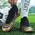 Tempesta Men’s Turf Football Boots in black with gold graphic details worn on artificial grass field with a football in the background