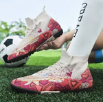 Tempesta Men’s Turf Football Boots in white with pink graphic details worn on artificial grass field with a football in the background