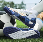 Tempesta Men’s Turf Football Boots in white with blue graphic details worn on artificial grass field with a football in the background