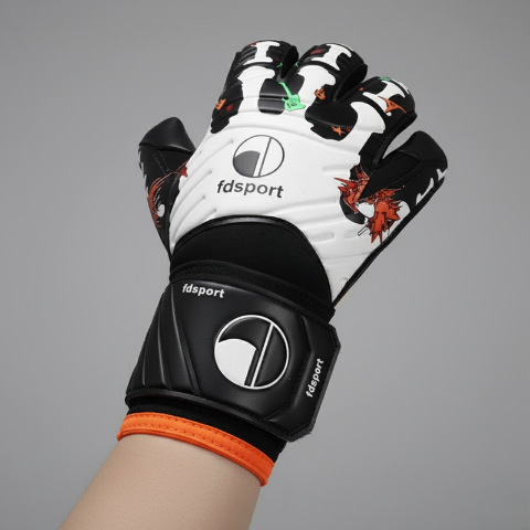Close up of a white and black Men’s Goalkeeper Glove El Torero with vibrant cartoon graphics worn on a hand against a plain grey background.