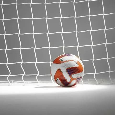 Vector football resting in front of a white goal net, suggesting a goal scored.